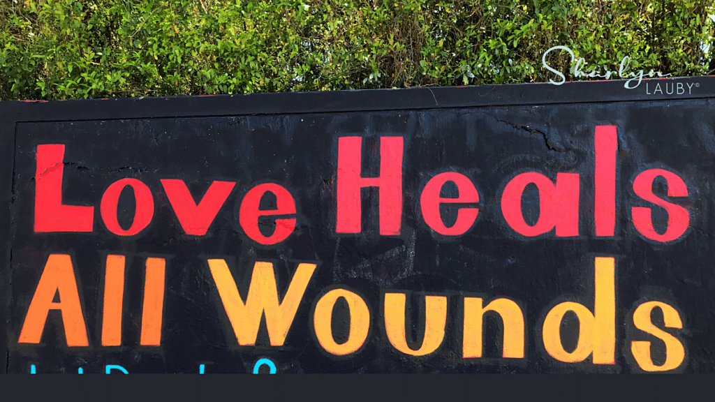 wall art love heals all wounds in caregiving