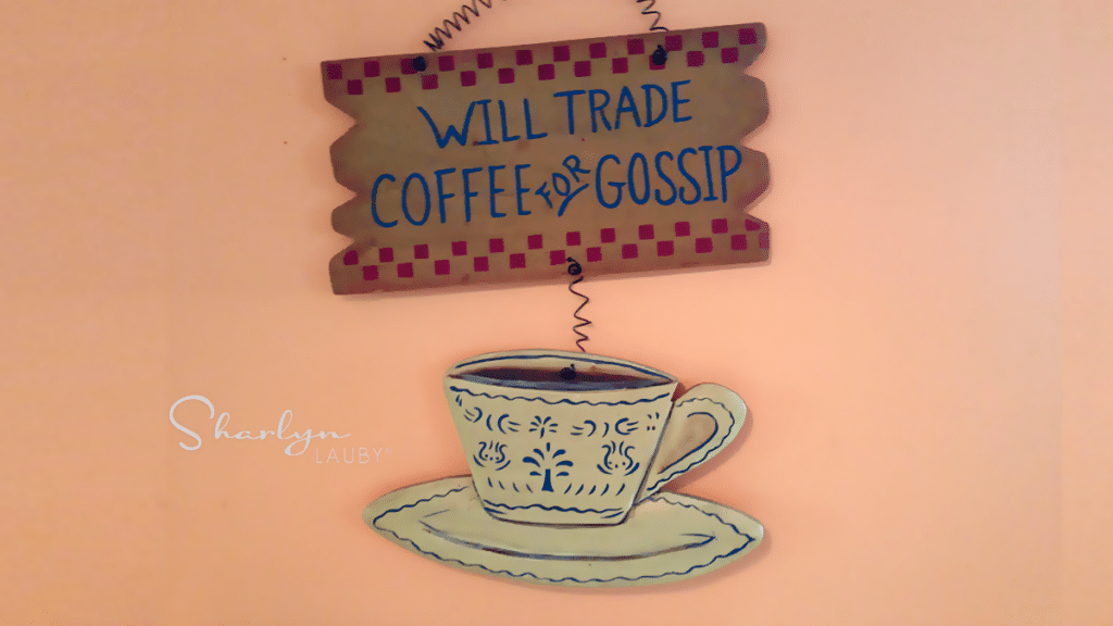 coffee shop sign will trade coffee for gossip referring to supply chain