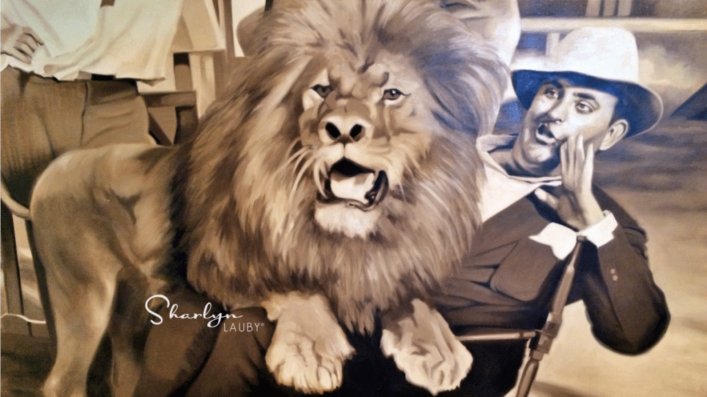 old movie image showing a man talking to a lion similar to trash talk in a workplace investigation