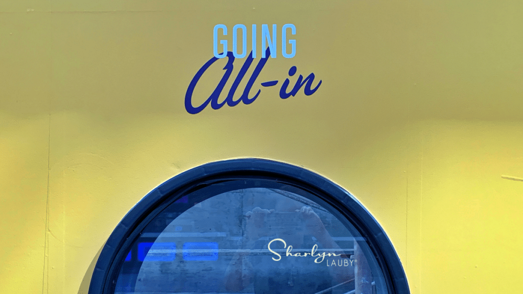 going all in sign over window at a hotel business meeting