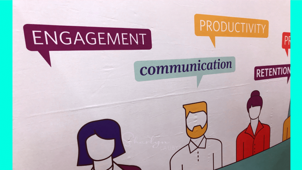 wall art manager discussing engagement productivity communication