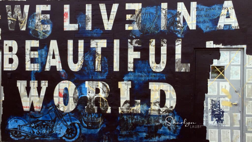 art mural nous vivons dans un monde magnifique avec l'activisme des employés