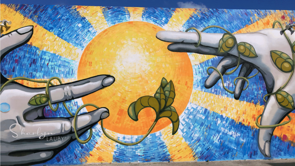 wall art showing hands reaching toward each other implying a gap analysis