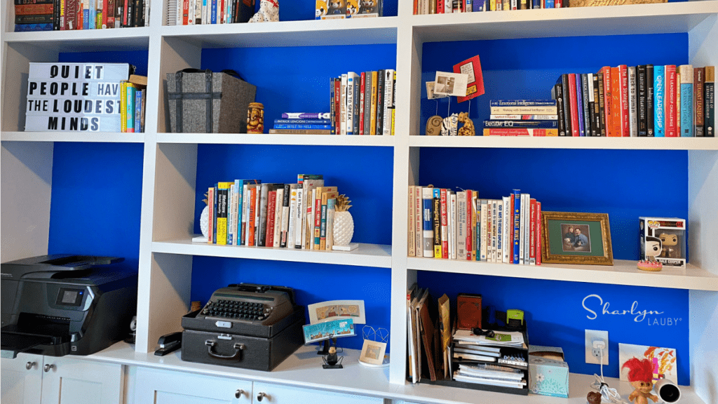 video background bookshelf with a variety of books and personal items