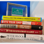stack of books that every HR professional should own