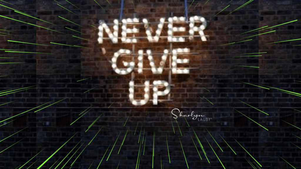 wall sign never give up meaning empathy