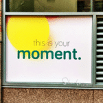 wall sign saying this is your moment in a returnship program