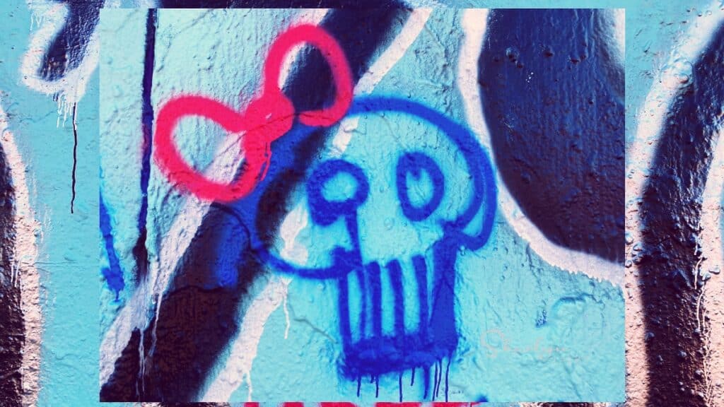 wall art graffiti showing skull with pink bow sick employee with COVID