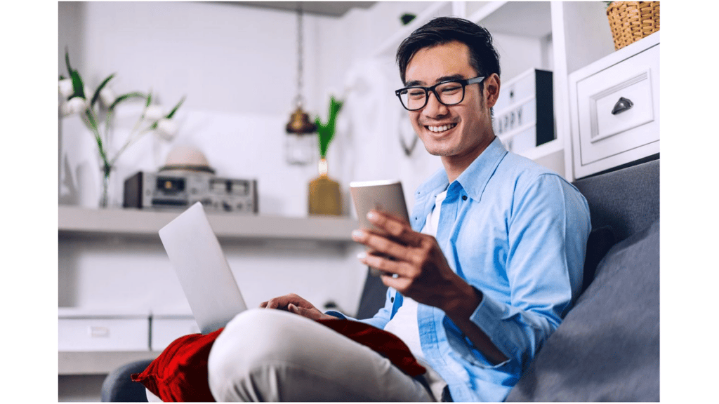 young employee looking at earned wage access app on smartphone