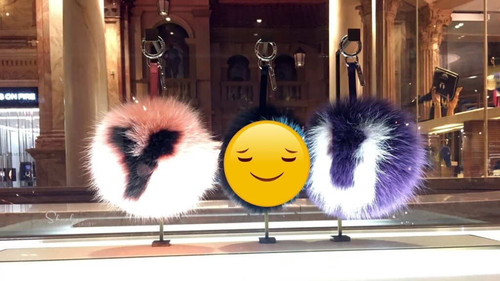 fuzzy key chains spelling you with serene emoji indicating good mental health