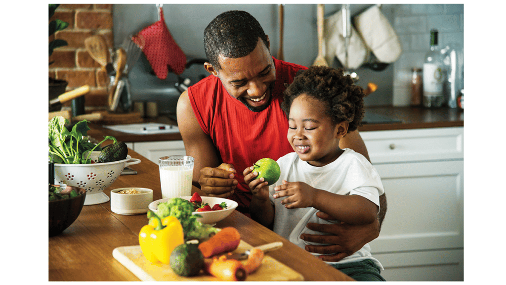 ADP Affordable Care Act image showing man sharing breakfast with child