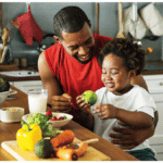 ADP Affordable Care Act image showing man sharing breakfast with child