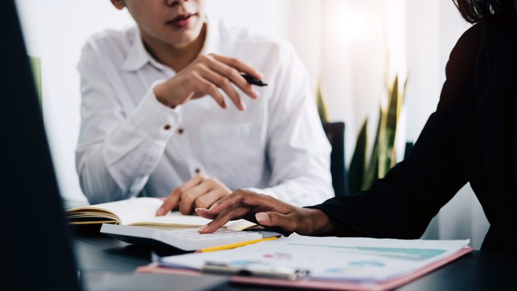 workplace employees at a desk planning investigations