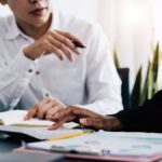 workplace employees at a desk planning investigations