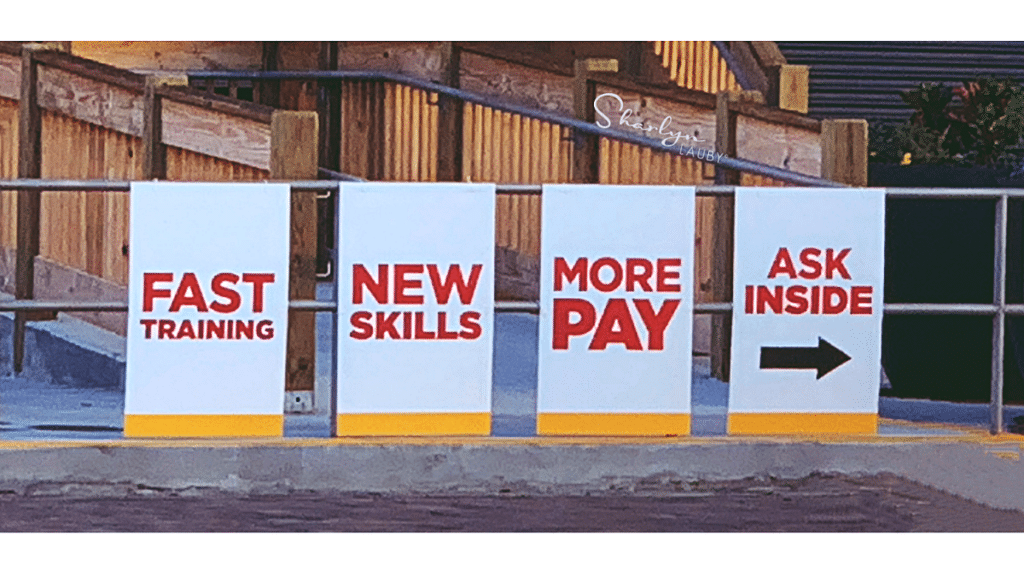 recruiting sign improved employee pay and in compliance