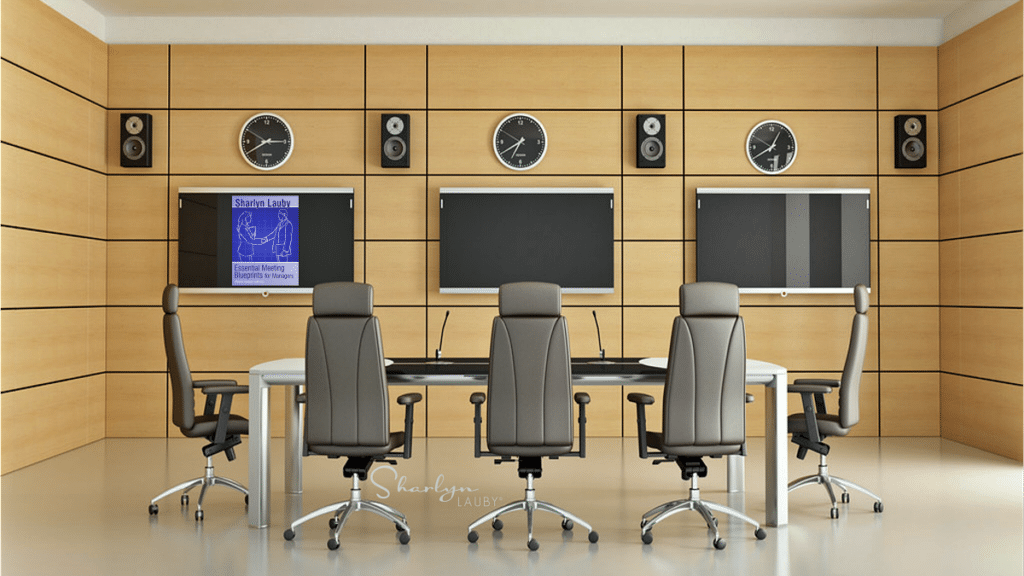 room for meetings showing Essential Meetings Blueprints for Managers on screen