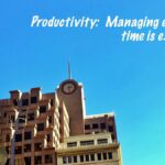 building exterior time clock heading on productivity and time management