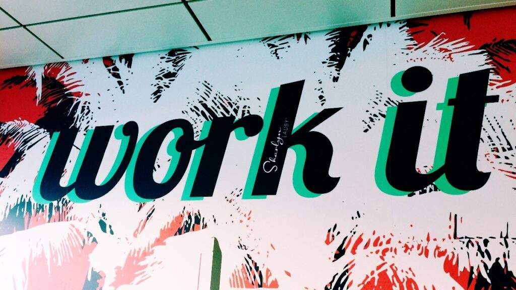 wall sign about productivity work it