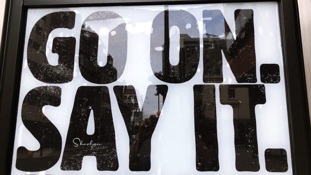 wall sign go on say it referring to listening styles