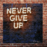 wall sign in lights never give up show resilience