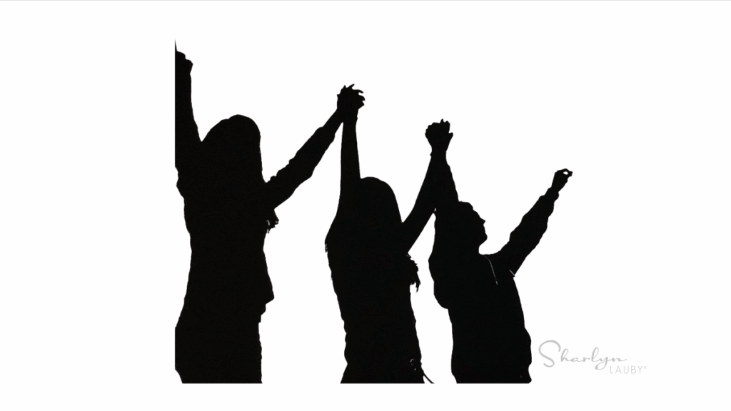 silhouette people cheering benefits of employee referral programs